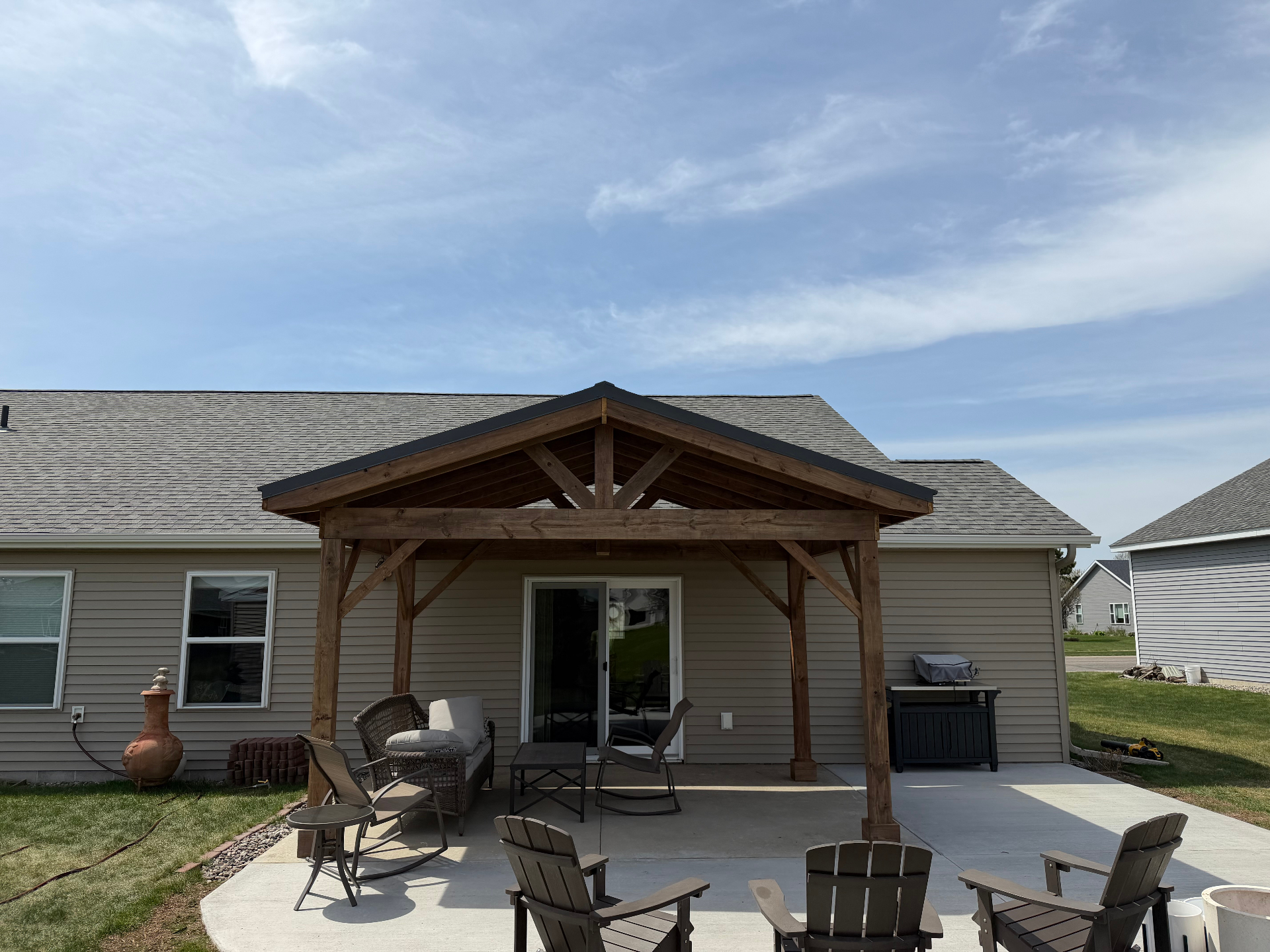 Cedar timber-frame covered patio addition built by 131 Contracting in central Minnesota